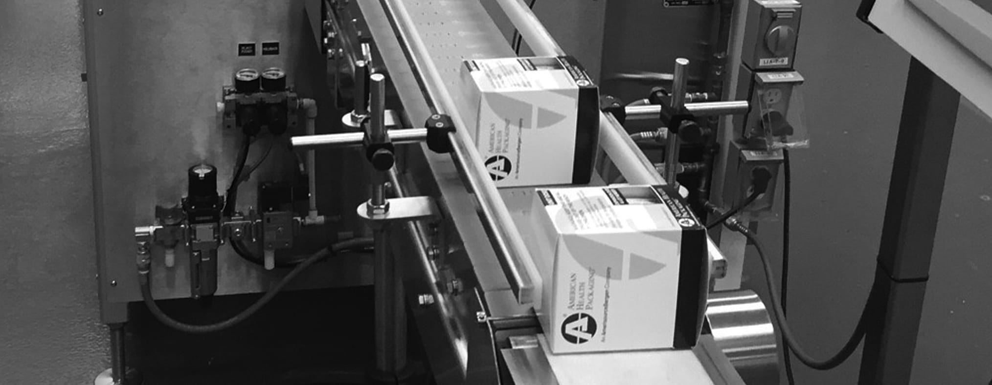 A series of products move down a conveyor belt